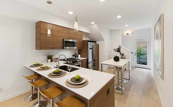 Kitchen with Bar Seating in One of the Lucca Townhomes Now Selling in Wallingford