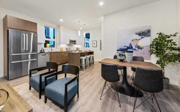 View from the Living Room to the Kitchen at 10447 Alderbrook Pl NW, One of the Hyacinth Homes in the Flora Collection in Greenwood