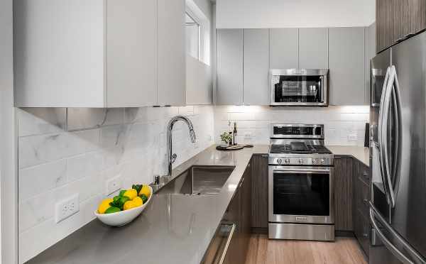 Kitchen at 10419 Alderbrook Pl NW, One of the Zinnia Townhomes in the Flora Collection