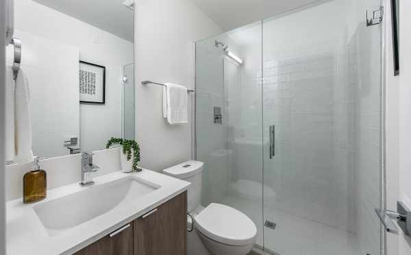 First-Floor Bathroom at 8551A Midvale Ave N, One of the Fattorini Flats North Townhomes by Isola Homes