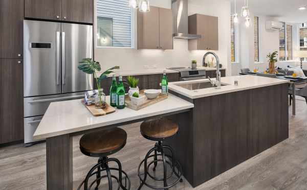 The Kitchen with Bar Seating in One of the Units in Oncore Townhomes