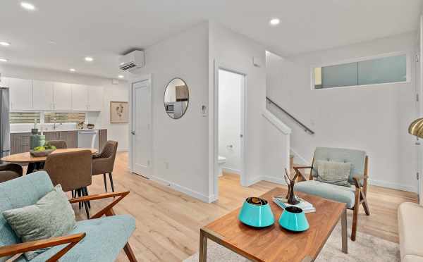 Living Room, Dining Area, and Stairs at 3238A 14th Ave W, One of the Harloe Townhomes by Isola Homes