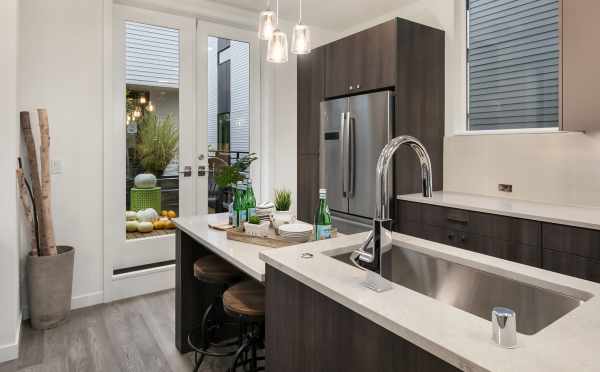 Kitchen and the Semi-Private Deck of One of the Units in Oncore Townhomes