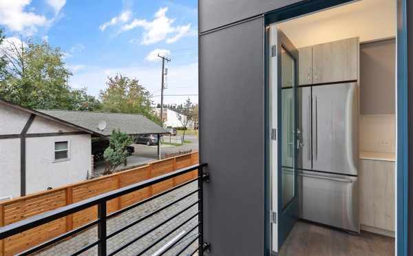 View from the Deck to the Kitchen at 10843 11th Ave NE, One of the Lily Townhomes by Isola Homes