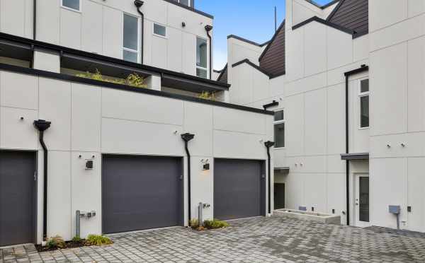 Garages and Parking Area for the Homes of Nino 15 by Isola Homes