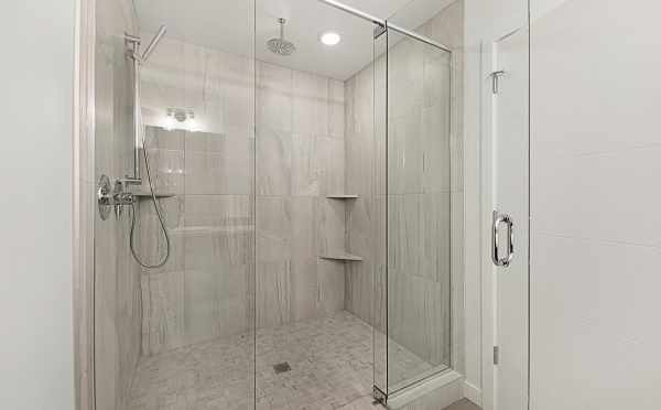 Large, Tiled Shower with Overhead Shower Head in the Twin I Townhomes